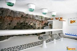 Modern bar with a white stone wall