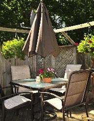 Wooden deck of a house with patio furniture