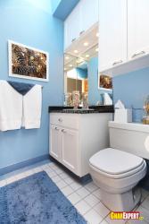 White vanity in blue colored bathroom