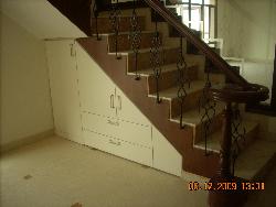 Round ending of stairs with veener on sides of steps incld storage under staircase