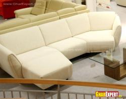 Modern orange curved sectional with small ottoman
