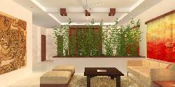 A green partition between living and dining spaces adds life to the interiors.