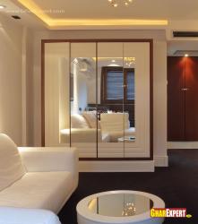 Looking mirror and white colored wood style for wardrobes