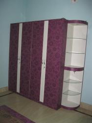 IT IS CHILDRENIS WARDROBE WITH CORNER UNIT WITH TWO LED LIGHTS AND TWO SET OF GLASS SHELVES . HANDLES HAVE BEEN GIVEN FLOWRAL. 