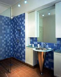 Tile Floor and wall tiles in Bathroom. Steel finish bathroom sink