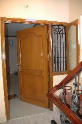 Varnished main door with teak wood