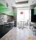 Tiled flooring in balck and green kitchen
