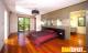 bedroom with wooden and black textured cabinets