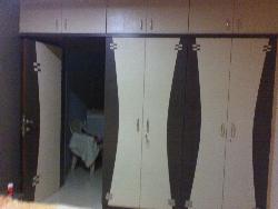 wardrobe with durai laminates Sliding wardrob laminate design