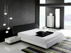 Black colored bedroom furniture including wardrobes and chests with wooden flooring Interior Design Photos