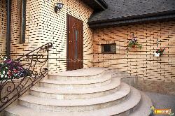 Exterior door design with stairs Railing and focussed wall design  of upper portion of door wall