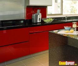 kitchen cabinets in stunning red theme with black marble stone top Interior Design Photos