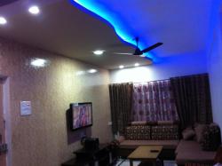curved POP false ceiling design with blue led lighting effect Interior Design Photos
