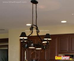 Wrought iron small chandelier on the kitchen island Interior Design Photos