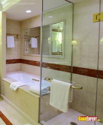 Bath tub and shower enclosure in full featured bathroom Full photo of celling