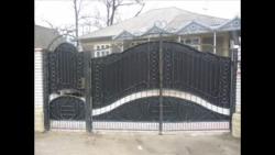 Main gate design in steel with safety door in side Design for safety door