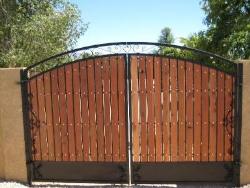wrought iron gate with wooden stripes in the main gate design _strip