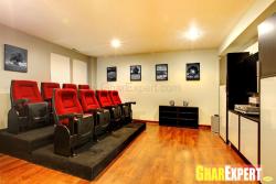 Home theatre with multi-sitting and hardwood flooring Balcony sitting