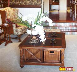 Honey wooden polish on center table with wicker storage Interior Design Photos