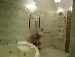 Bathroom in large space with Jacuzzi and shower panel  with n