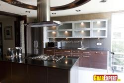 Modular kitchen with cooktop on the center island Interior Design Photos