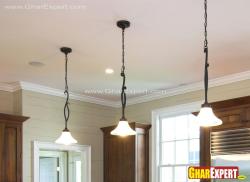 Three sleek hanging lamp lights for Kitchen Interior Design Photos