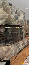 fireplace unit kept inside the cove in stone cladded wall   4 dedroom