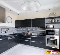 Fully equipped modern italian kitchen with dark color veneer and steel accessories Italian marble 