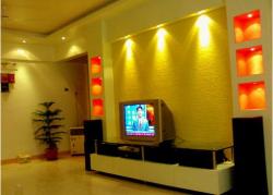 lcd unit with glass shelf and coves with colored background Interior Design Photos