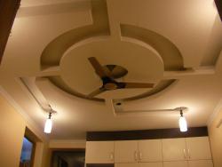 p.o.p ceiling design with a round design in the center Interior Design Photos