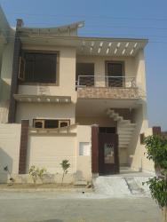Simple elevation for a corner double story building Double story elevasion kothi image