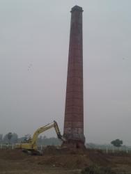old chimney smoke stack dismantling by poclain breaker machine Majlis ciling old dising
