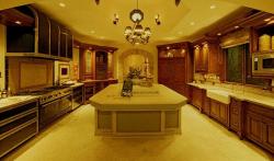 Warm yellow lights, marble flooring in a large kitchen with island Yellow baby