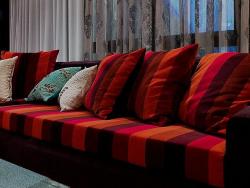 colorful couch with striped cushions Backless couch