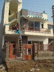 Exterior view of house under Construction work  of foundation work in building construction