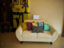 multi color cushion on white upholsered sofa Interior Design Photos