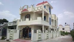Duplex house,4bhk,corner plot, with SS Railing,Wooden door/windows, sloped roof balcony,decorative porch ceiling, MS Gate, grill and compound wall. Compound designs