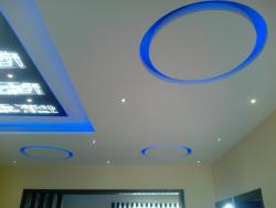 Ceiling with blue cove lights and circular concept Interior Design Photos