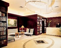 hotel lobby with small library and seating Interior Design Photos