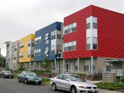 Same style elevations for consecutive buildings only difference in color Interior Design Photos