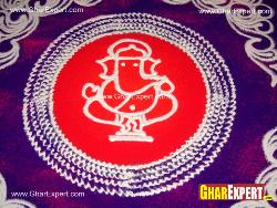 Colorful rangoli representing Ganesha on Ganesh chaturthi Fornt main loha gatein ganesh and laxmi murti