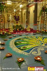 Colorful rangoli with diyas arrangement on ganesh chaturthi Fornt main loha gatein ganesh and laxmi murti