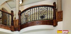 Iron grill with carved wooden balustrades Box grill verandah