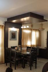 a dining space and wooden ceiling design Interior Design Photos