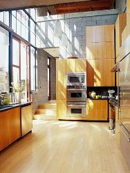 Wooden unit for appliances in kitchen. Wooden finish cabinet. Wooden Flooring. Hanging Kitchen Light Fixtures Interior Design Photos