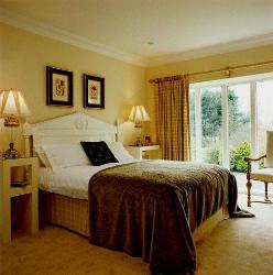 Cozy Bedroom Lighting, large windows with window curtains and carpet flooring Interior Design Photos