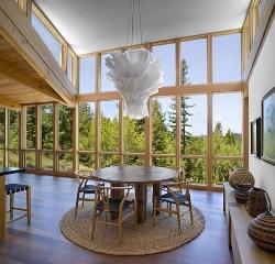 Double height living room with large windows wooden flooring, modern chandelier Height of cieling